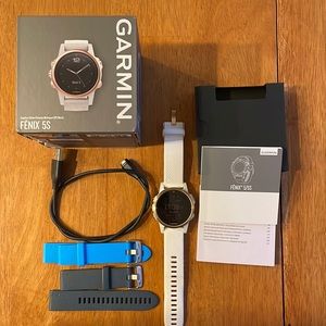 Garmin Fenix 5s Sapphire edition Rose gold tone with white band.